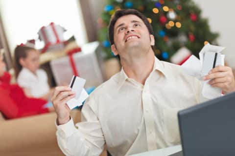 man frustrated over holiday debt